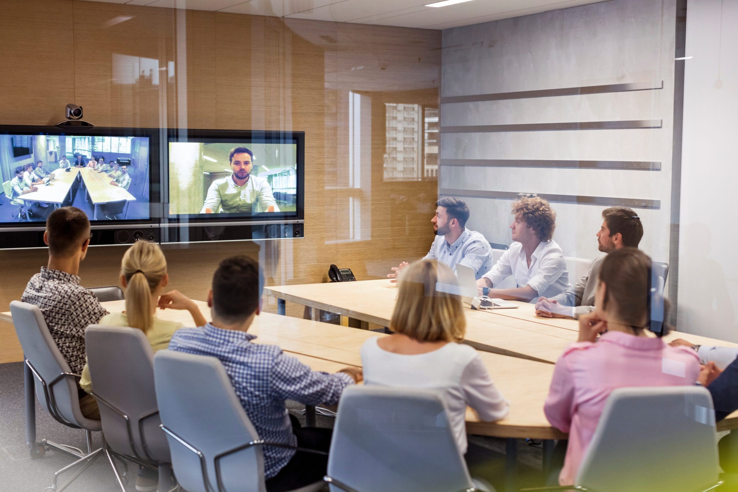 group of people sitting around a conference table
